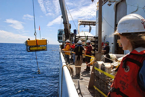 Research cruise, lowering or raising equipment on boat.